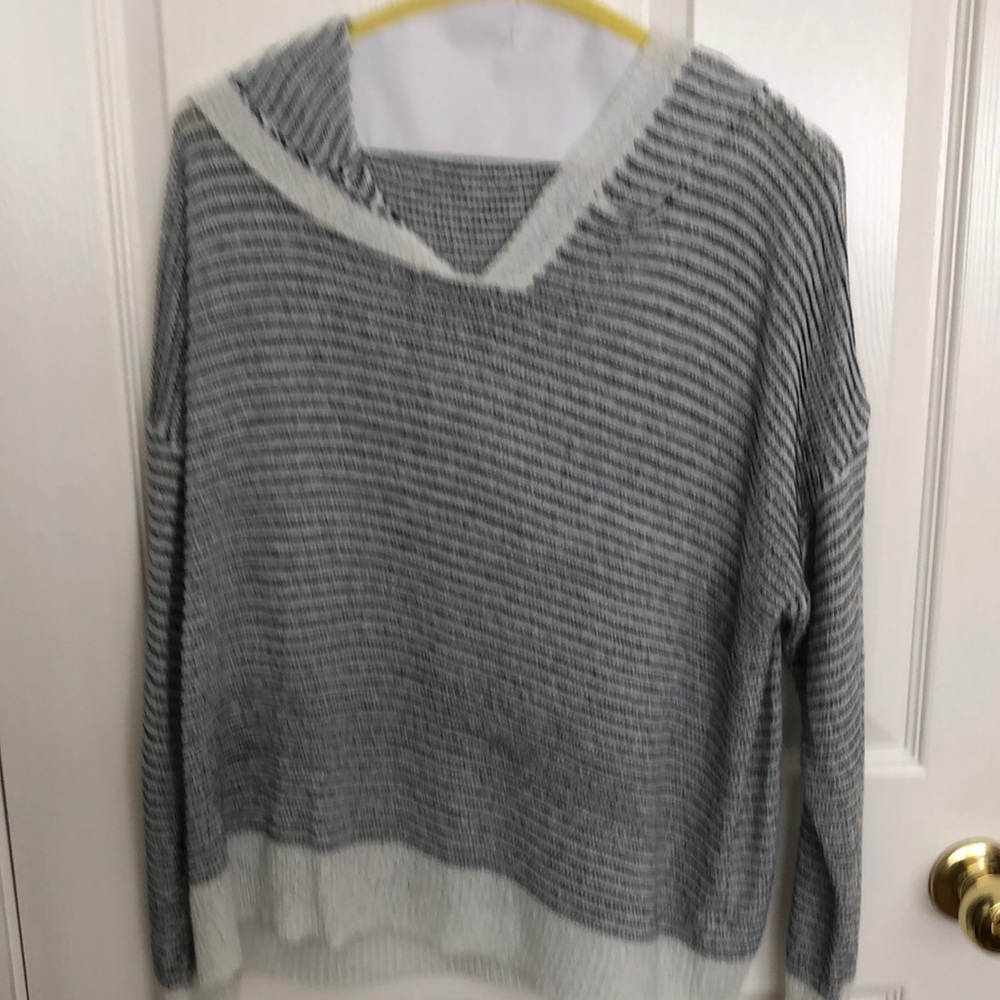 2 hooded sweaters black and white/ and Nancy blue and white.